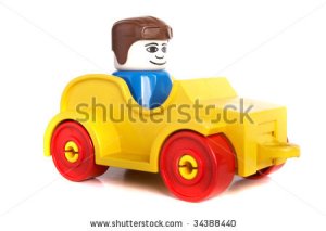 stock-photo-toy-car-with-driver-over-white-background-with-lots-of-copyspace-the-car-has-slight-shadows-to-34388440