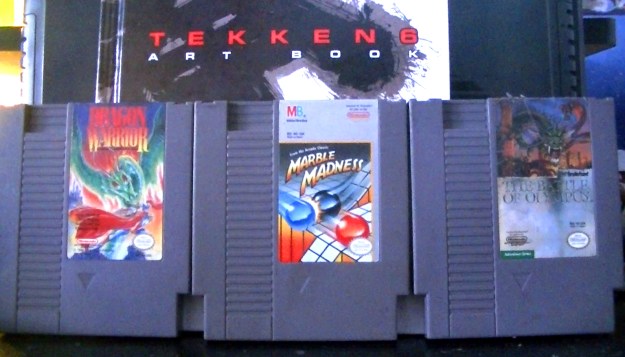 The final three games I bought on their last day, plus a Tekken 6 artbook the main owner was selling.